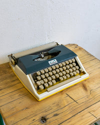 Macchina da scrivere Montanina gialla e blu vintage