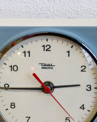 Orologio da parete Diehl in ceramica bianco e azzurro con timer – anni ’50