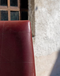 Poltrona da ufficio vintage bordeaux in semilpelle con rotelle – 1970